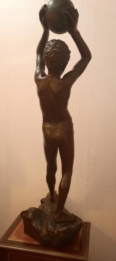 Antique sculpture "A young man on a stone"