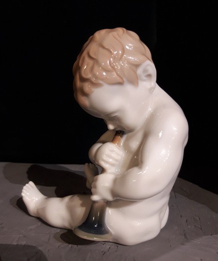 Antique sculpture of a little boy