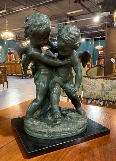 Antique cupids sculpture
