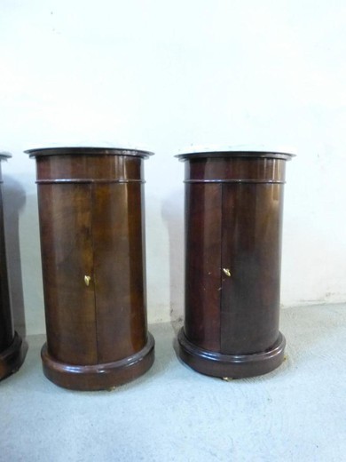Set of four antique pedestal consoles