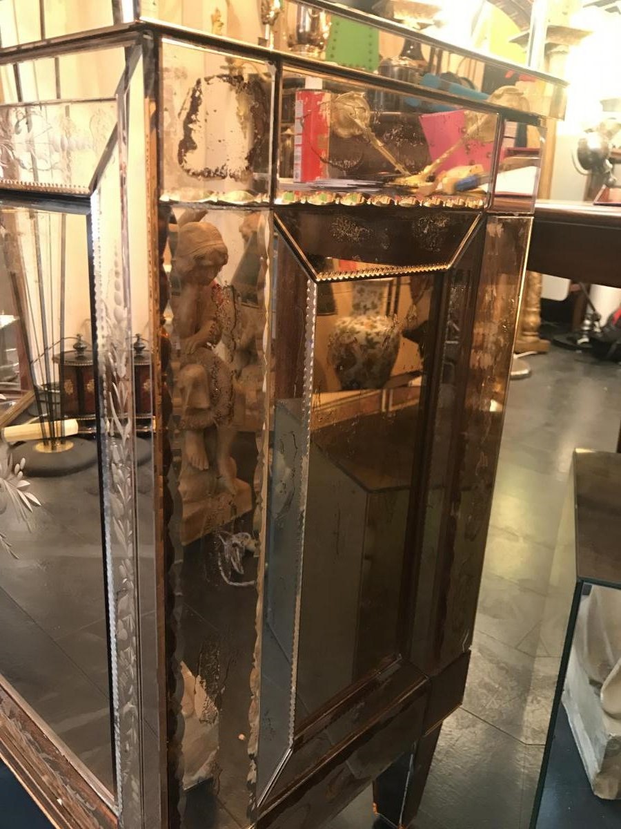 A Venetian glass mirrored commode