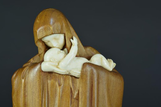 Antique sculpture of Virgin Mary with a child