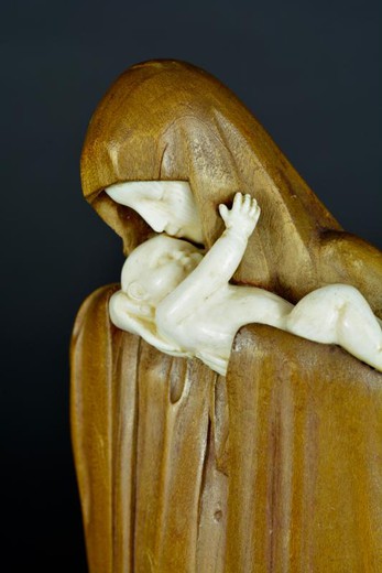 Antique sculpture of Virgin Mary with a child