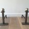 Jacques Adnet. Pair of modernist steel and chrome andirons. Circa 1920-40