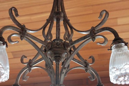 old cast iron and glass chandelier