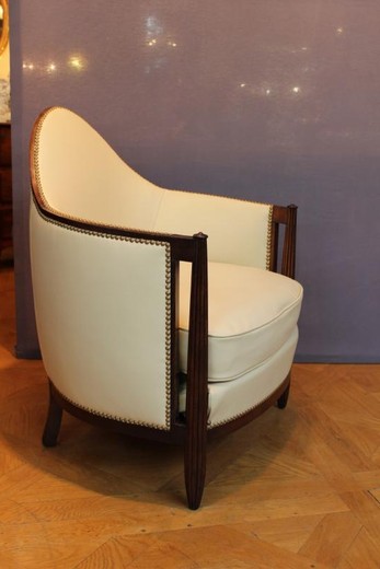 old leather and beechwood armchairs