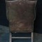 Старинное кожаное кресло с оттоманкой