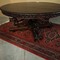 antique hunting style table with carved legs