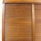 Storage cabinet with tambour door