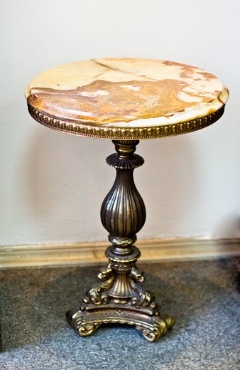 antique pedestal table in bronze