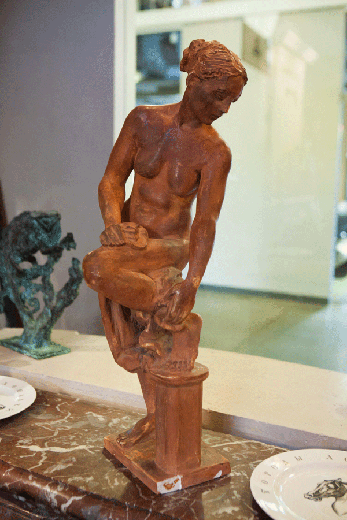 old sculpture of bather gilr