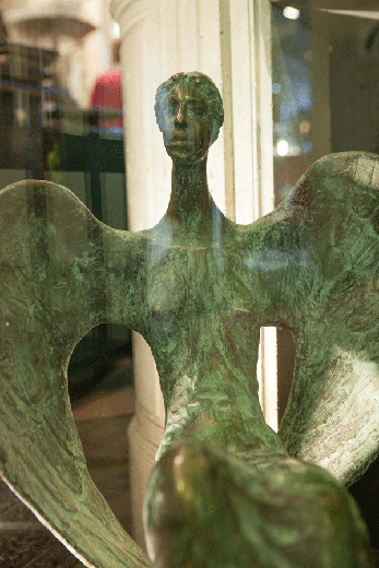 old bronze sculpture of protecting goddess