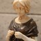 Antique sculpture serene young woman