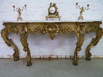 A gilt consoltable with marble top 