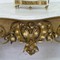 A gilt consoltable with marble top 