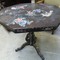 An Asian tailtop table inlaid with Mother of pearl.