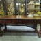 An antique Spanish table in chestnut with 3 drawers