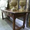 An antique Spanish table in chestnut with 3 drawers