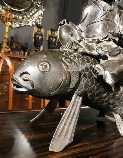 Antique sculpture "Kinko Sennin on a Fish"