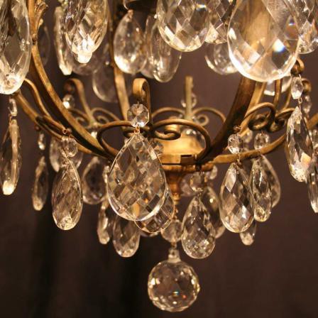 Elegant and remarkable antique ceiling light. The material is gilt bronze and top quality crystal drops. Western Europe, the early 20 C.