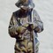 Sculpture " A boy with fishing-rod"