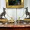 Antique fireplace andirons with greyhounds