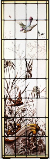 Antique stained glass window with birds