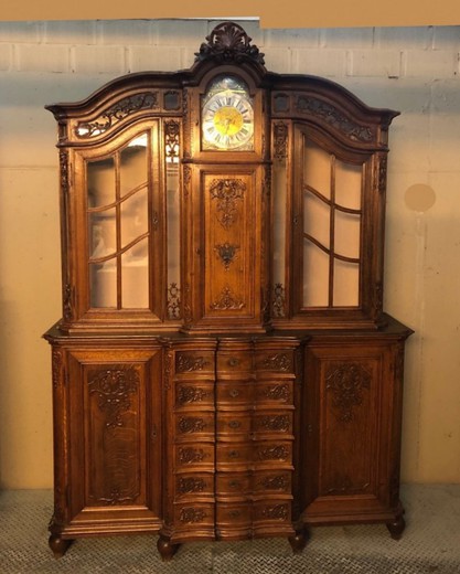 Antique showcase with a clock