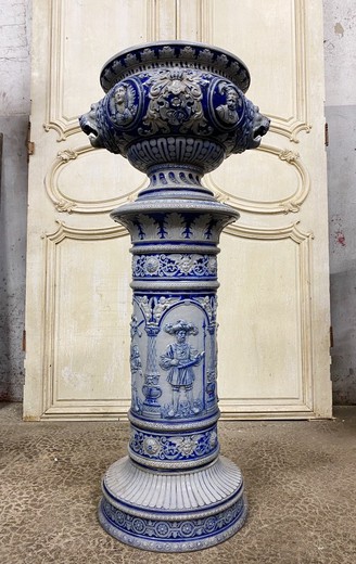 Antique flowerpot on a column