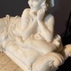 Young Woman In Marble Lying On A Couch Sculpture