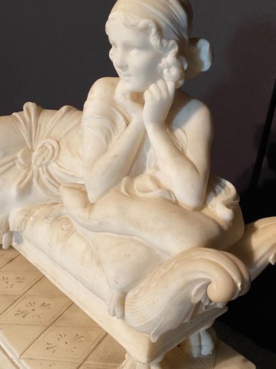 Young Woman In Marble Lying On A Couch Sculpture