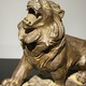 Antique sculpture of a lion on a rock
