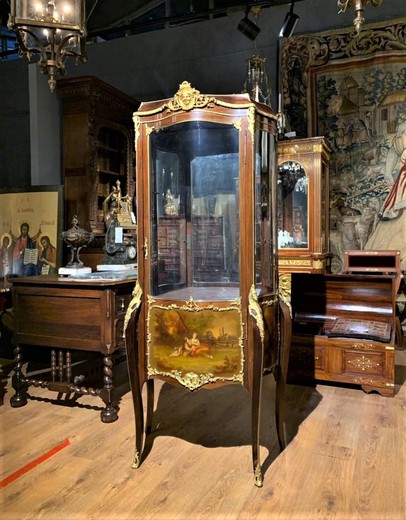 Antique showcase in Louis XV style