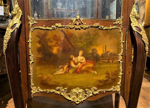 Antique showcase in Louis XV style