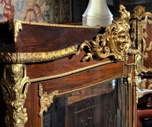 Antique showcase in Louis XV style