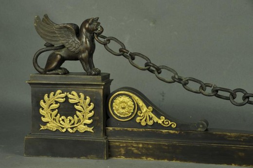 Antique fireplace bar with winged lions
