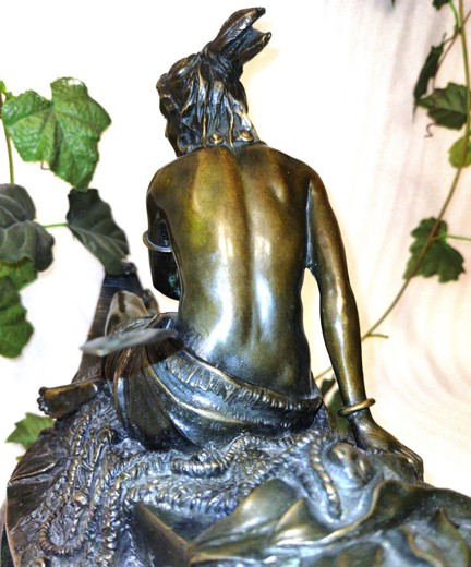Antique sculpture "Indians in a canoe"