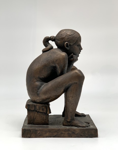 Sculpture "Sitting girl"