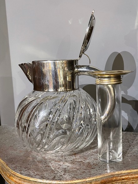 Antique jug with ice cube