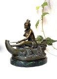 Antique sculpture "Indian woman in a canoe"