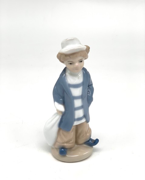 Vintage figurine "Boy with a bag"
