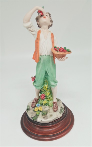 Antique figurine "Boy with a cherry", Capodimonte