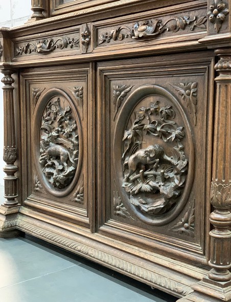 Antique sideboard in hunting style
