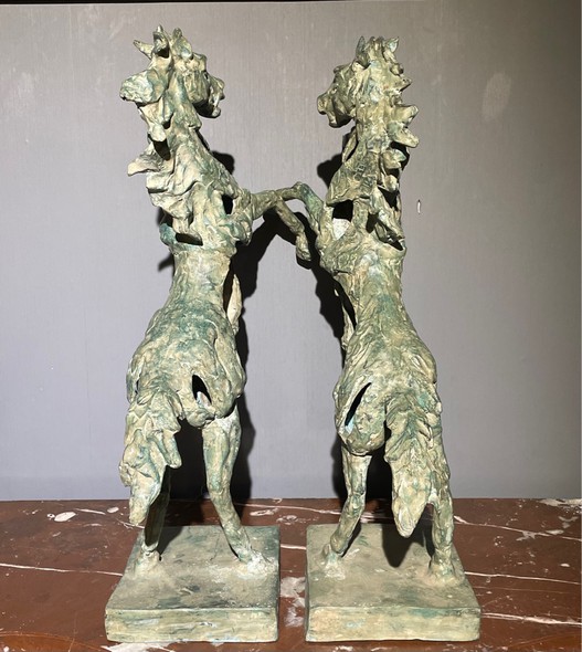 Paired sculptures of horses
