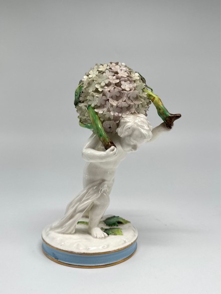 Antique porcelain "Boy with flowers"