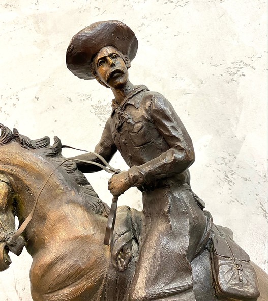 Bronze sculpture of a cowboy