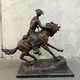 Bronze sculpture of a cowboy