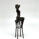 Antique sculpture "Girl on a chair"