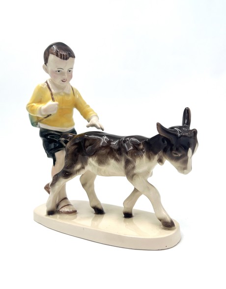 Antique statuette "Boy with a goat"