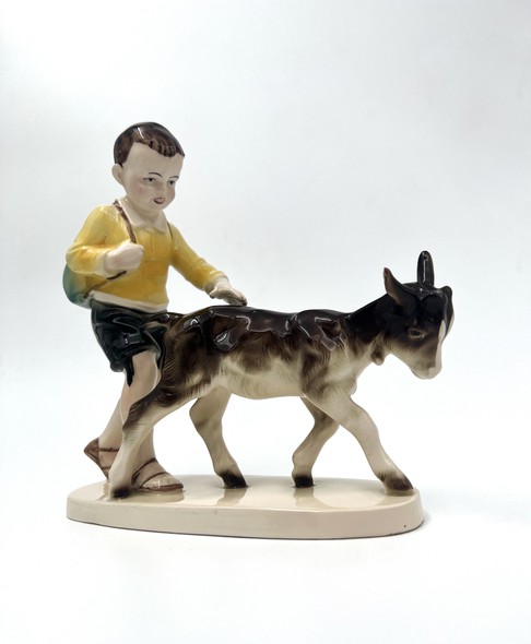 Antique statuette "Boy with a goat"